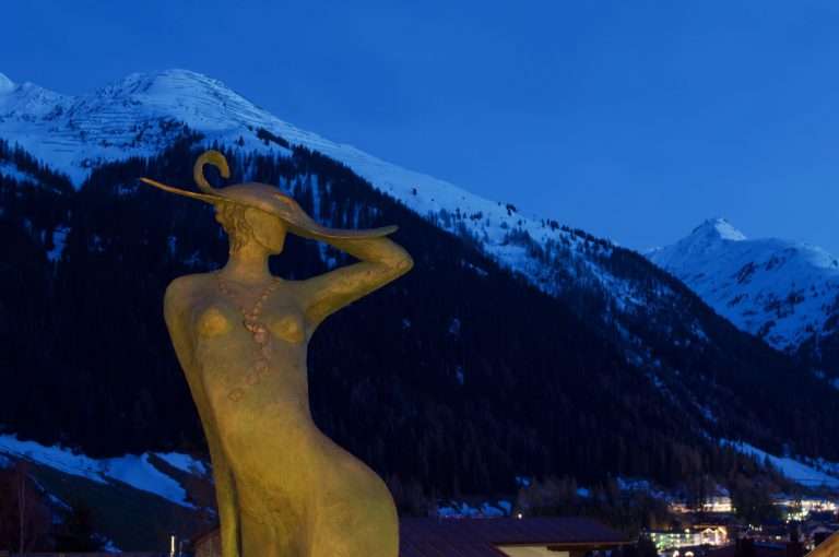 Luxury Chalet Artemis St Anton Austria statue at dusk